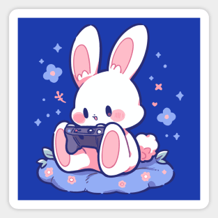 A tiny rabbit playing video games Magnet